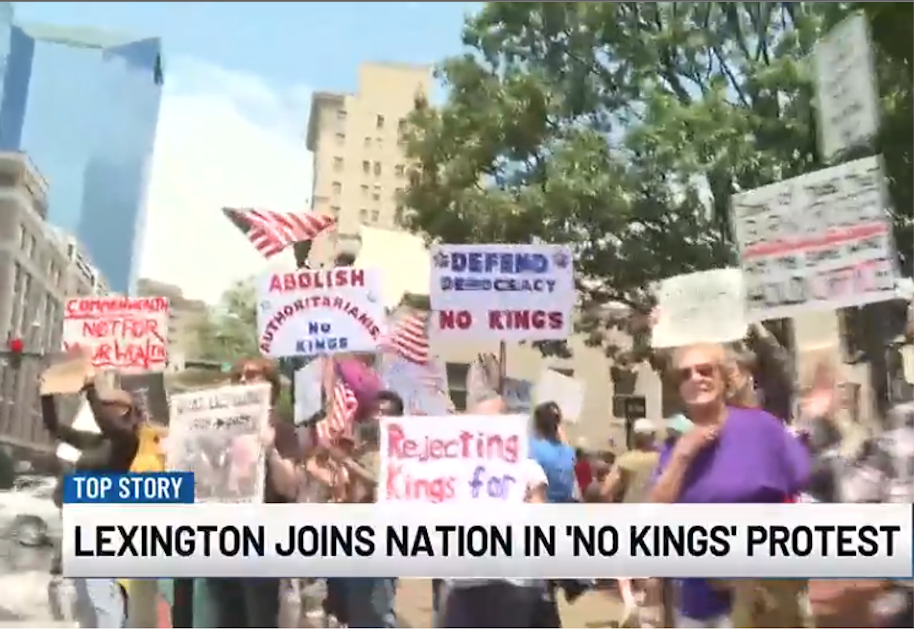 Protestors with signs in city street